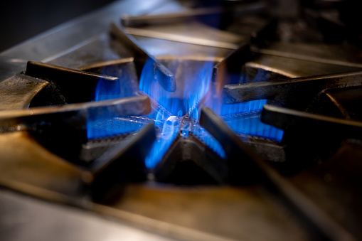 Close-up on a gas stove at a commercial kitchen