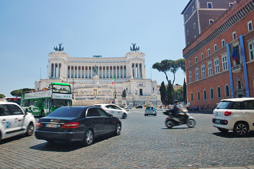 13th June, 2022: Rome traffic zooming around the Imposing Vittoriano Memorial in Piazza Venezia, Rome, Italy