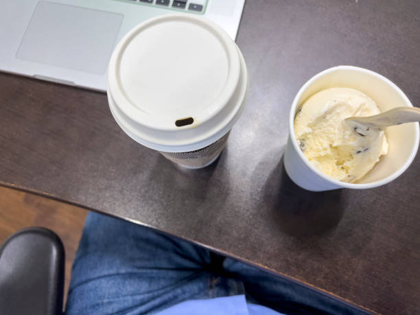 Coffee and ice crea on the office desk