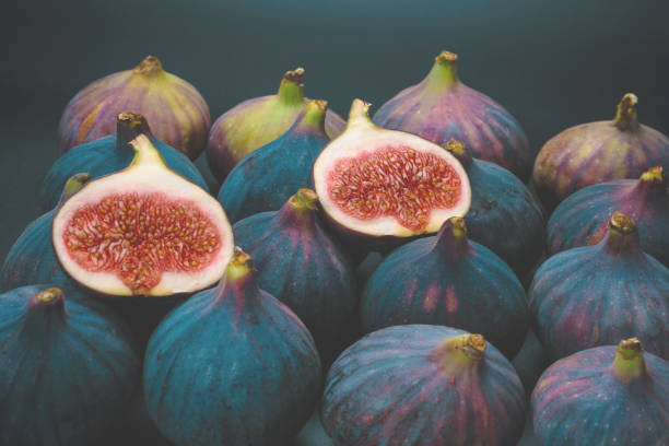 istock Tasty figs on a black background. Top view. 1409734577