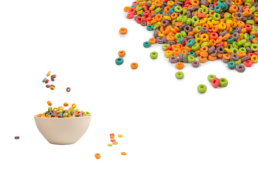 Sweet multicolored flakes, cereal loops. Isolated on a white background.