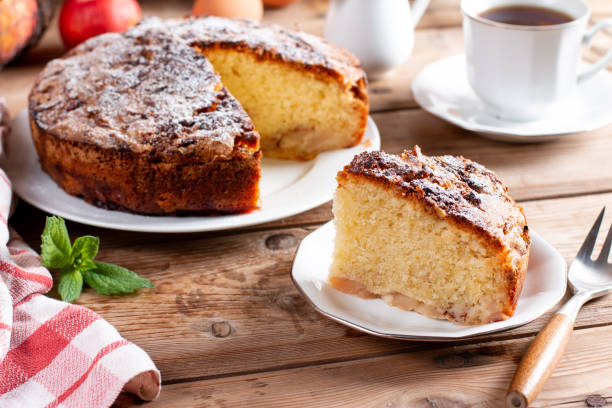 istock Clasic sponge cake with apples on table, selective focus. Homemade cake 1409734870