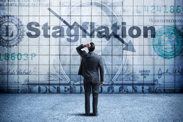 Businessman Looking Up At a Chart That Indicates Stagflation stock photo