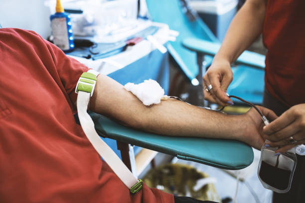 patient donating blood at hospital. - bloedbank stockfoto's en -beelden