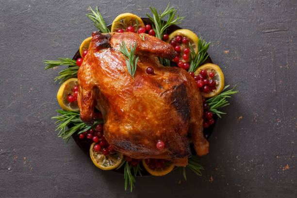 istock Grilled chicken on Christmas or Thanksgiving dinner table 1409738471