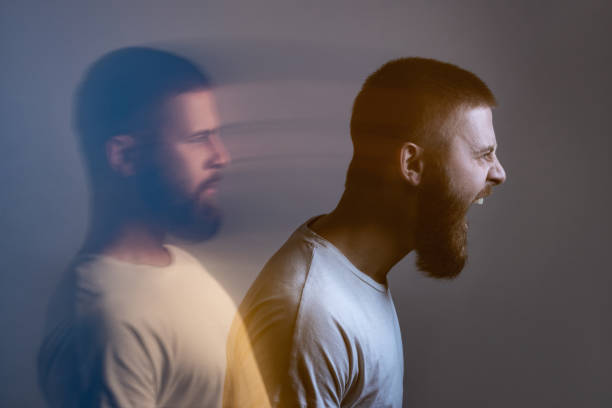 istock Side view portrait of two-faced man in calm serious and angry screaming expression. 1409739054