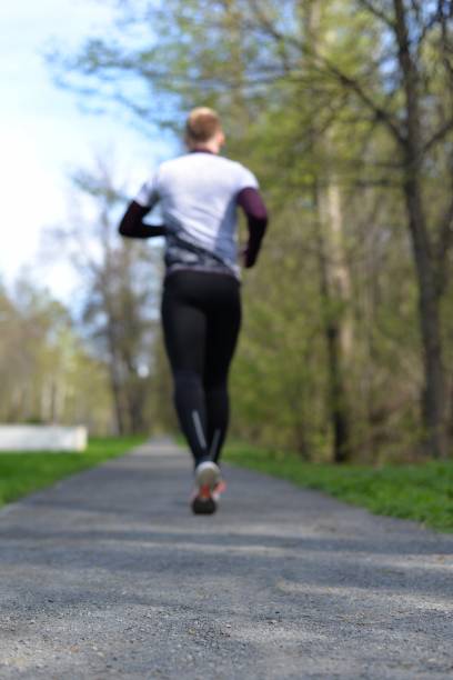 running jogging training park nature recreating listen music healthy life
