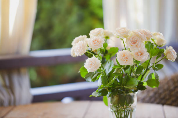 istock roses in glass vase 1409739881