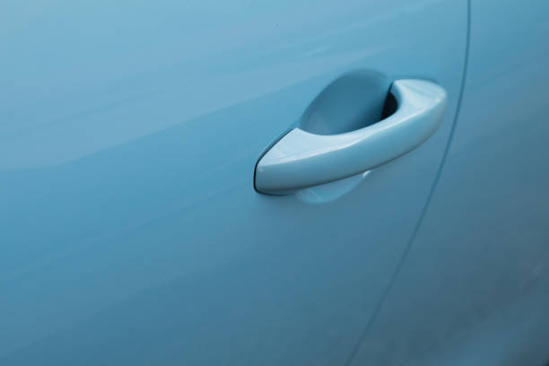 istock Doorknob of electric car 1409740093
