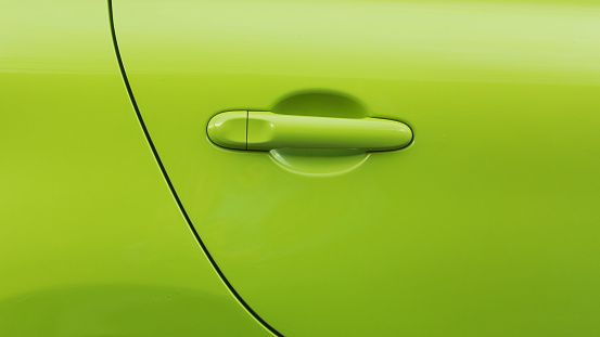 Detail and door  of green colored car