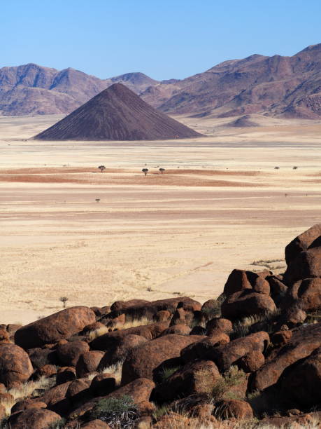 istock African landscape with conical black mountain 1409741204