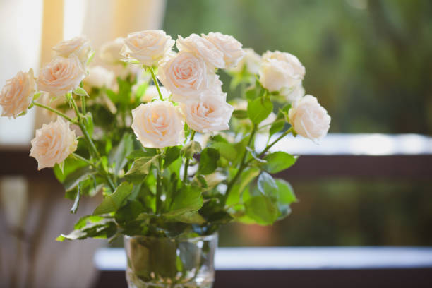 istock roses in glass vase 1409742142