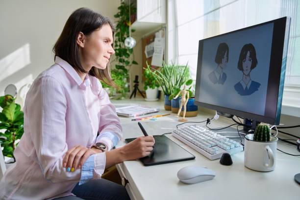 istock Young female graphic designer drawing sketch on graphics tablet 1409742537