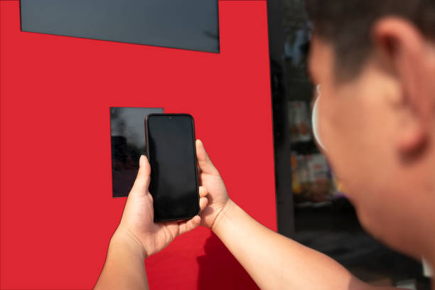 Asian man use to make contactless payment