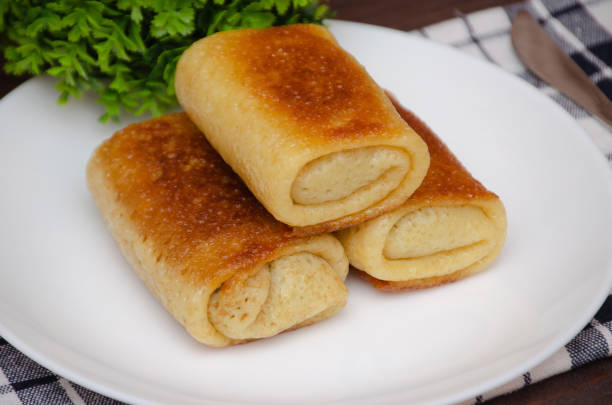 istock Delicious stuffed pancakes served on a white plate 1409746303
