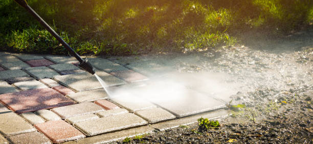dirty block pavement cleaning with high pressure washer. copy space stock photo
