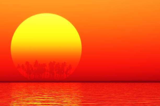 silhouette of island in tropical tranquil sea with palm trees and big yellow sun behind them