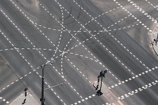 Crossroad is place at which one may safely cross city street. Four crossing ways top view.