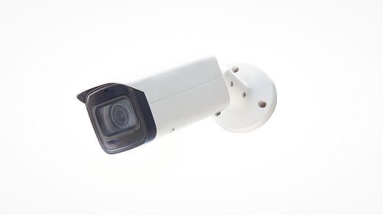 Closeup of white outdoor type surveillance cctv (closed circuit television) digital security camera with waterproof cover isolated in white background.