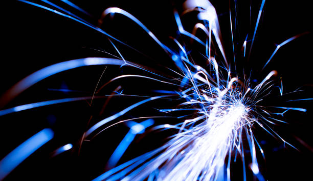 istock blue sparks in the dark. lines of light. 1409751258