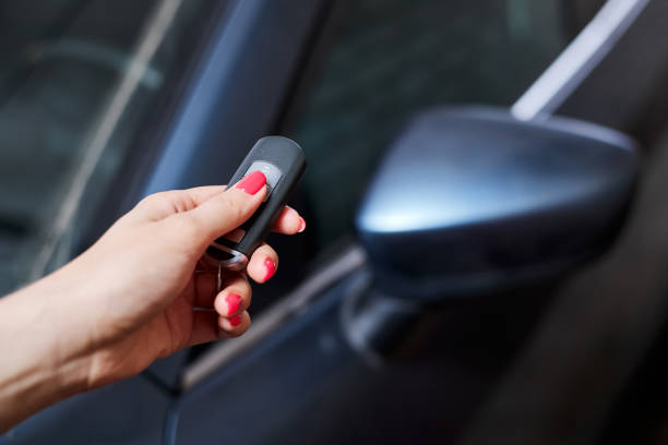 istock The car owner holds in his hand a remote control device for keyless entry. Close-up, selective focus 1409756021