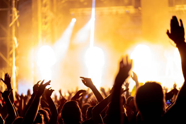 istock Music festival crowd with on stage fire 1409756030