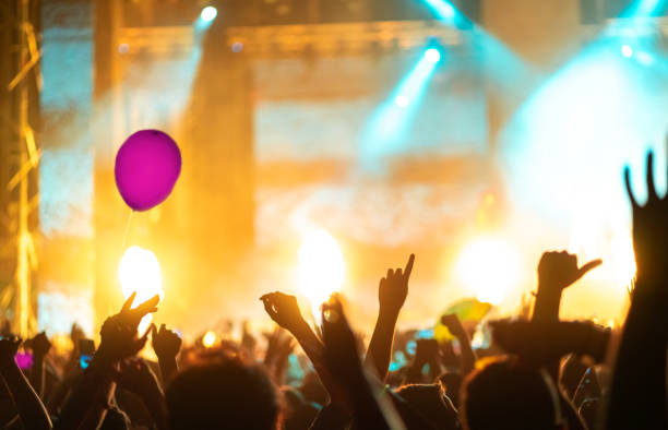 istock Music festival crowd with on stage fire 1409756048