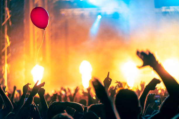 istock Music festival crowd with on stage fire 1409756053