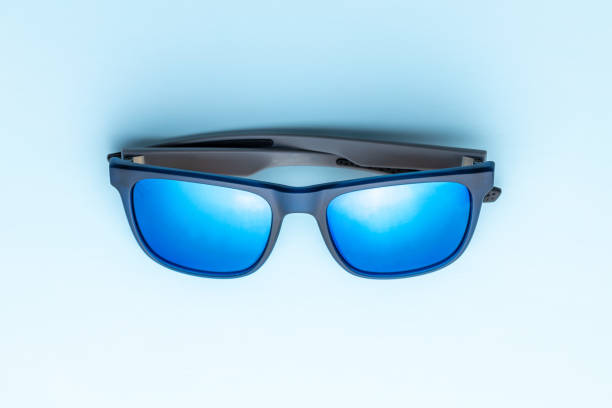 istock fashion sunglasses on blue background. 1409756973