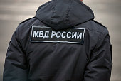 Ministry of Internal Affairs (MBD) of Russia - the inscription on the back of policeman in Cyrillic.