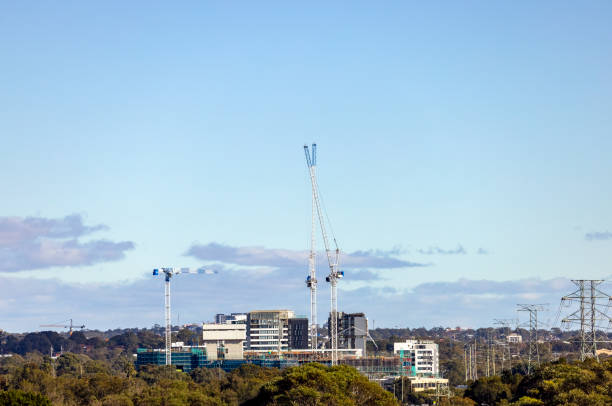 Building new suburb, City Skyline with tower cranes, background with copy space, Sydney, full frame horizontal composition