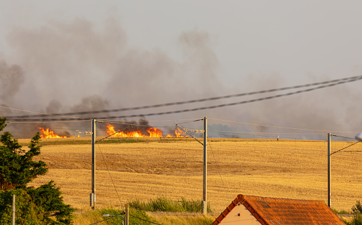 Suddenly burning grain field (probably triggered by the heat wave) near Wiremeux/Côte d'Opale in northern France on July 19, 2022, with subsequent firefighting operations. The daytime temperature was just under 40 degrees Celsius.