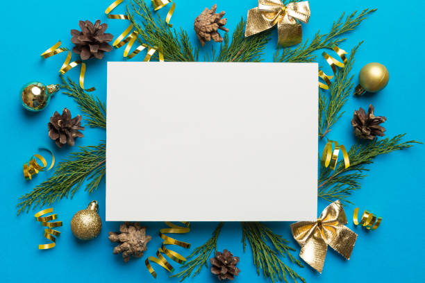 istock Flat lay Christmas composition. square Paper blank, pine tree branches, christmas decorations on Colored background. Top view, copy space for text 1409770165