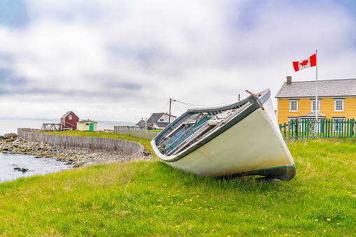 Boat on the shoreline of the coast of Bonavista, Newfoundland, Canada