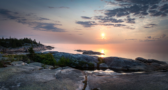 Majestic sunrise, natural light early in the morning on the shore of St-Lawrence river, Paradis Marin, Quebec, Canada