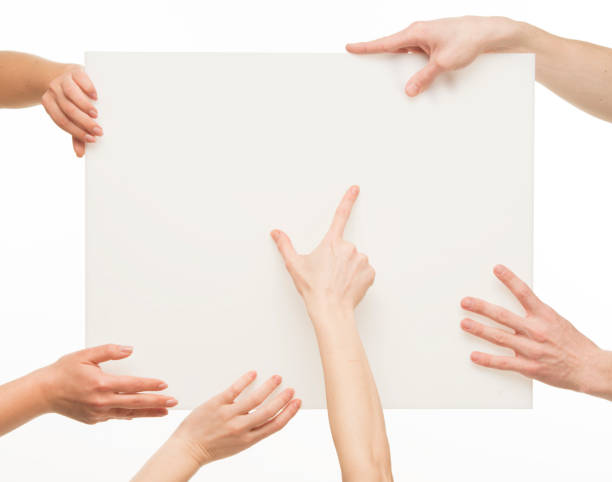 istock human hands holding whiteboard.group team of human hands with whiteboard isolated.business transportation logistics concept. 1409771576