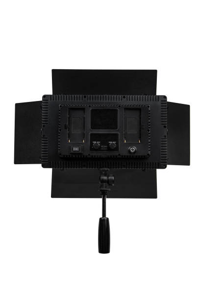 istock Photo and video lamp isolate on white background. LED lamp with special shutters for the formation of light flux. Photo and video lighting fixture. 1409774192