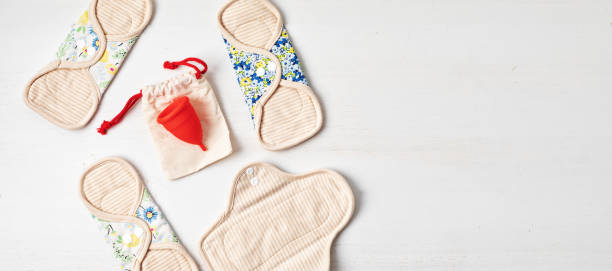 istock Zero waste periods kit. Reusable sanitary pads and menstrual cup 1409784439