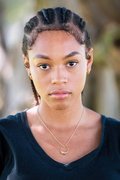 istock Serious afro-latinx young woman looking at the camera 1409787949