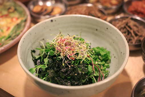 Traditional Japanese wakame salad with sesame seeds. Healthy and fresh seaweed salad.