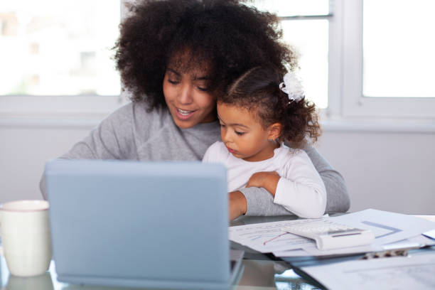 istock Young mother working and spending time with her daughter 1409790744