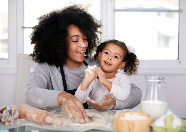 istock Mother and daughter are baking together 1409790757