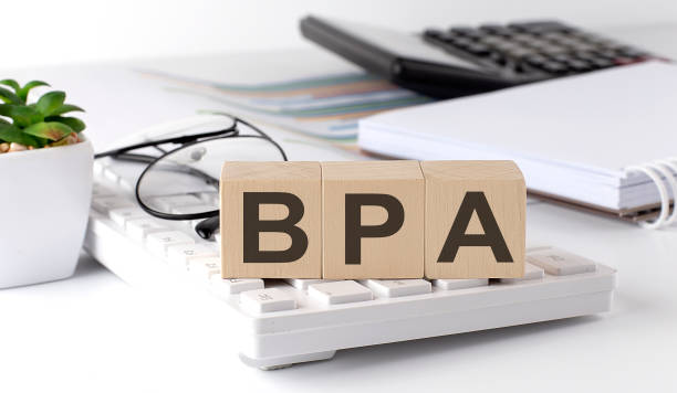 istock BPA - Business Process Analysis written on a wooden cube on keyboard with office tools 1409792764