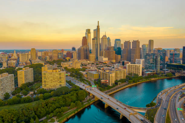 Amazing Close Skyline Of Philadelphia, Pennsylvania From Aerial Drone Point Of View During Sunset Sunset view of iconic and gorgeous skyline in Philadelphia, Pennsylvania, USA over Schuylkill River and Interstate Highway colonial government stock pictures, royalty-free photos & images