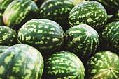 pile of watermelons in grocery store