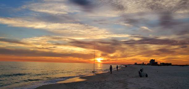 istock Fishing on the Beach at Sunset 1409794735