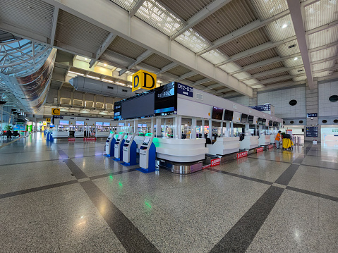 Kaohsiung, Taiwan - July 19, 2022: empty airport without tralvers due to impacts of COVID 19 pandemic on aircraft business - at checking in counter