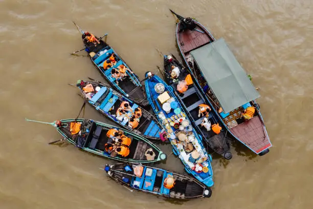 Photo of Tourists having breakfast on small boats on Cai Rang River, Can Tho, Vietnam