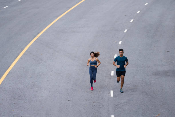 istock Asian couple, they are jogging and exercising. 1409803423