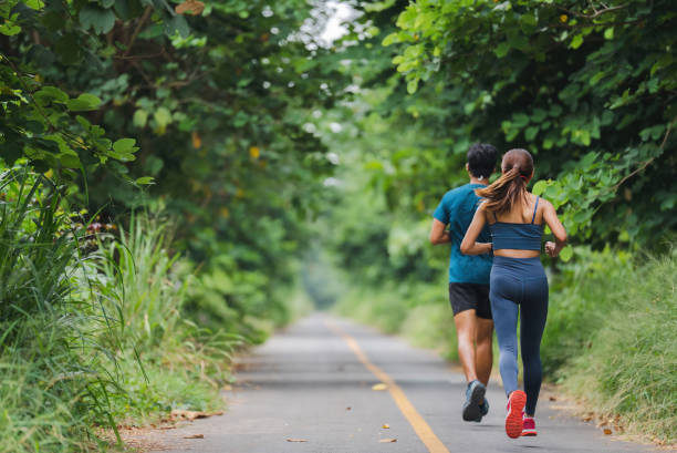 istock Asian couple, they are jogging and exercising. 1409803640